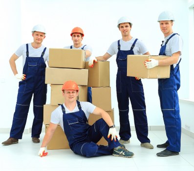 House removalists in Stjohnswood organizing boxes in a moving truck