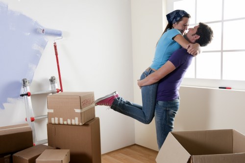 Furniture pick-up service removing bulky sofa from a Stjohnswood home