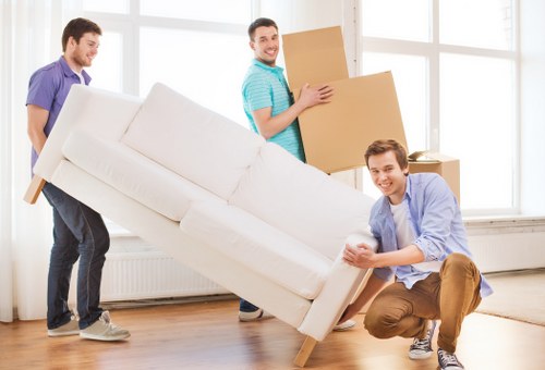 Team handling furniture safely during a man and van move