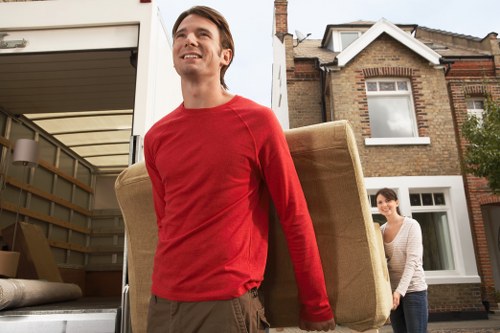 Professional furniture collection team loading unwanted items in Stjohnswood