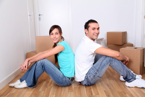 Professional movers loading furniture into a removal van