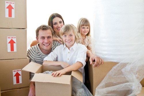 Furniture and boxes being loaded into a van for transport