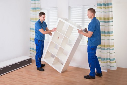 Careful loading of household items by a St Johns Wood man and van service